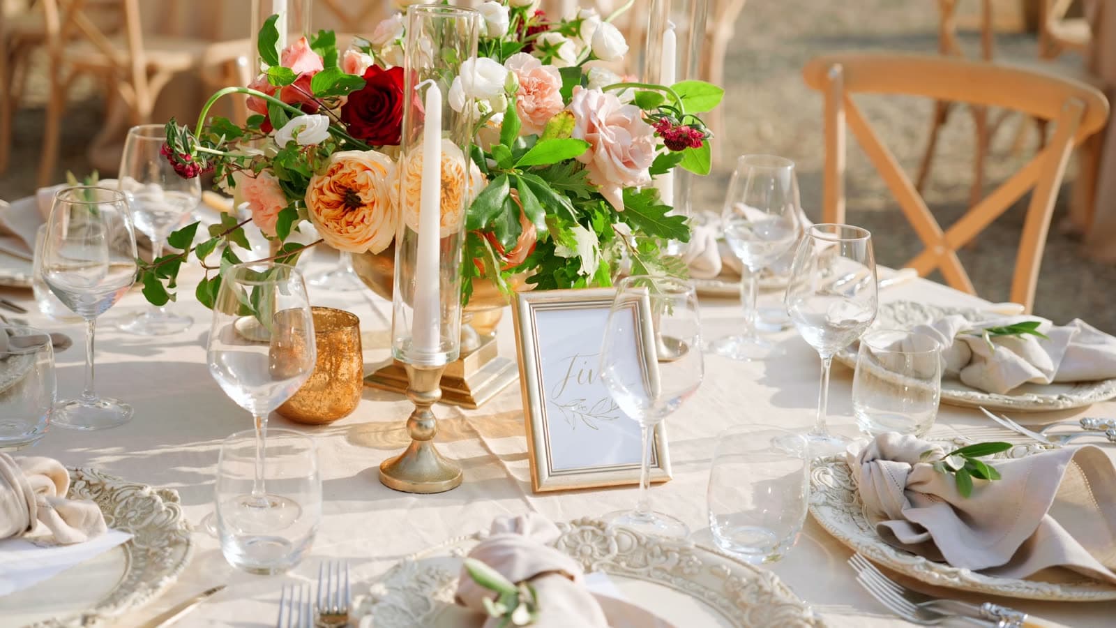 An elegant event space styled with large floral installations