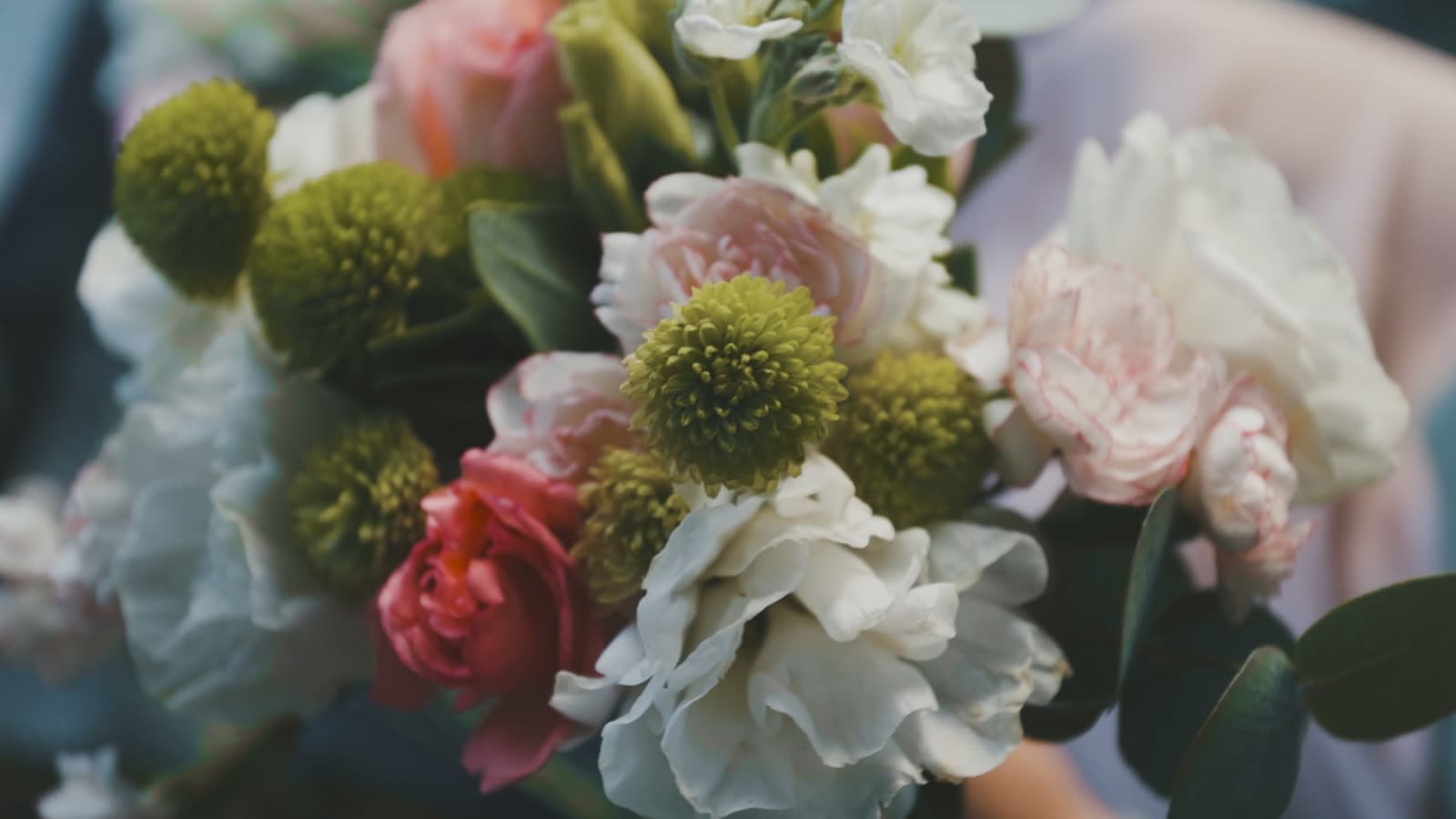 A floral ceremony arch in golden-hour light